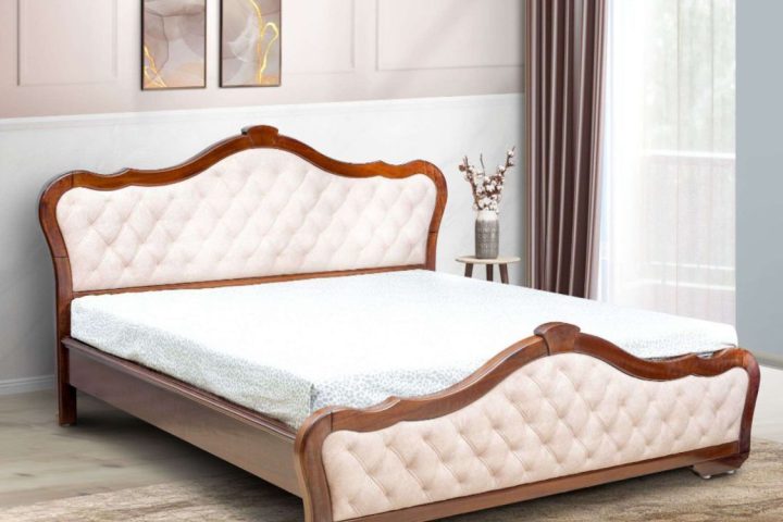 Wooden bed with curved, tufted headboard and footboard