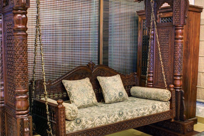 Carved wooden swing chair (jhoola) with cushions
