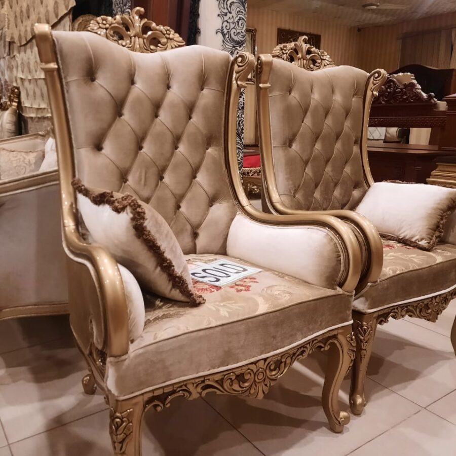 Gold tufted high-back armchair — front view