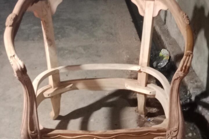 Crest-carved armchair — workshop photo