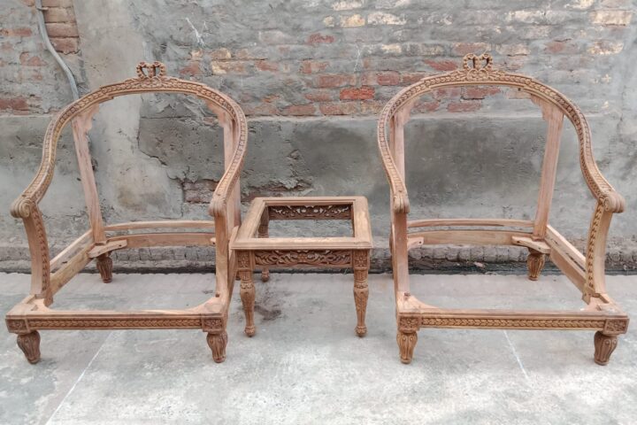 Laurel-trim carved armchair — pair with side table in the workshop