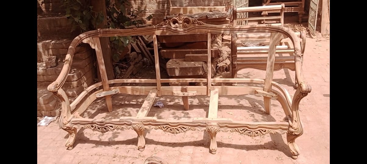 Arched carved sofa — workshop photo, front view